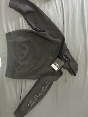 Girl’s Black Hoodie with Studded Chest Logo and Sleeve Detail.